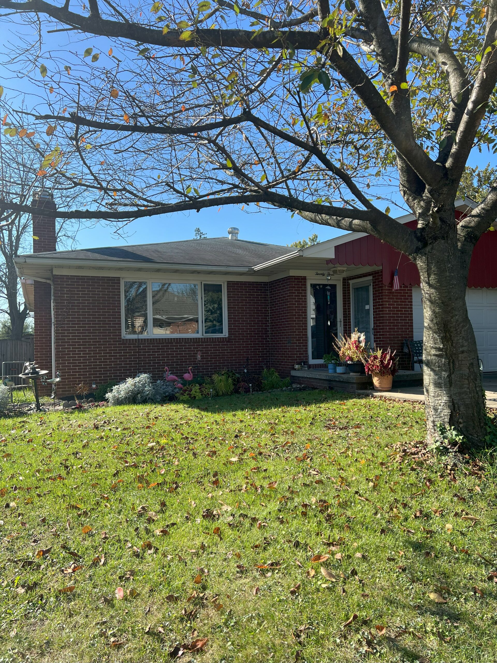A small brown house located in the Glen Burnie and Brookly Park area. The house is well kept and maintained. 
