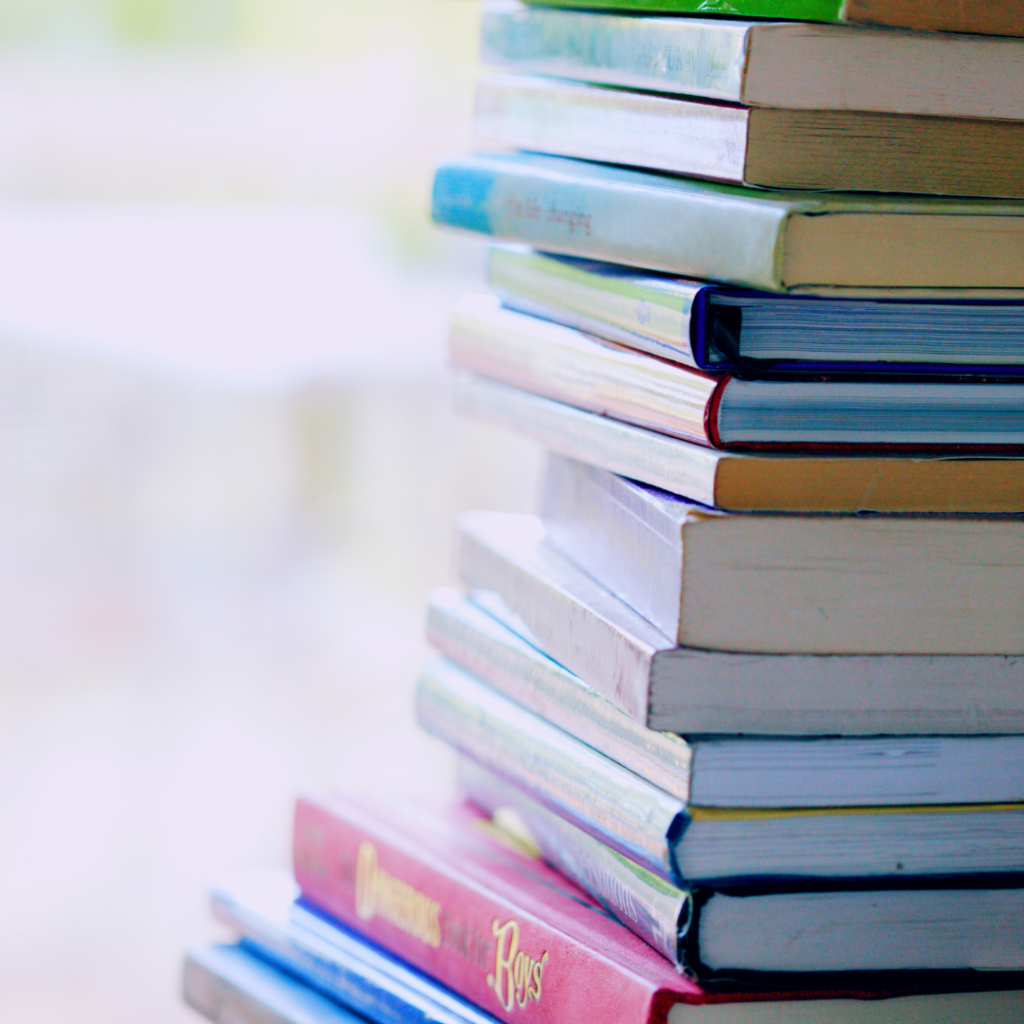 A stack of books. Arundel House of Hope has helped people improve their literacy skills. Improved literacy skills helps people increase their self sufficiency and stability.  